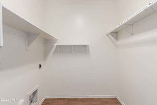 washroom featuring hookup for an electric dryer and wood-type flooring