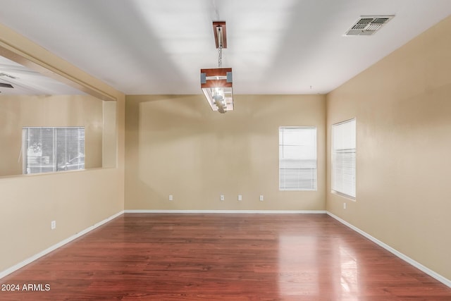 unfurnished room featuring hardwood / wood-style floors