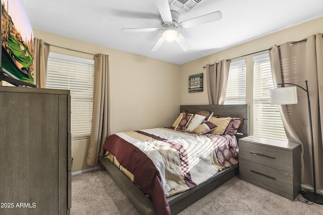 2111 N 77th Gln, Phoenix, AZ 85035 - bedroom with light carpet and a ceiling fan