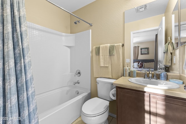 2111 N 77th Gln, Phoenix, AZ 85035 - bathroom featuring shower / bath combo, vanity, and toilet