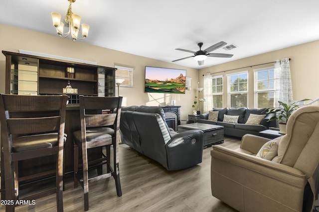 2111 N 77th Gln, Phoenix, AZ 85035 - living room with a chandelier, wood finished floors, and ceiling fan