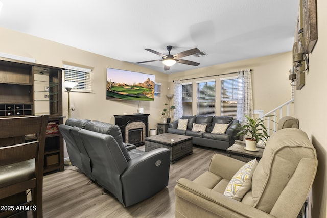 2111 N 77th Gln, Phoenix, AZ 85035 - living area featuring ceiling fan and light wood-style floors