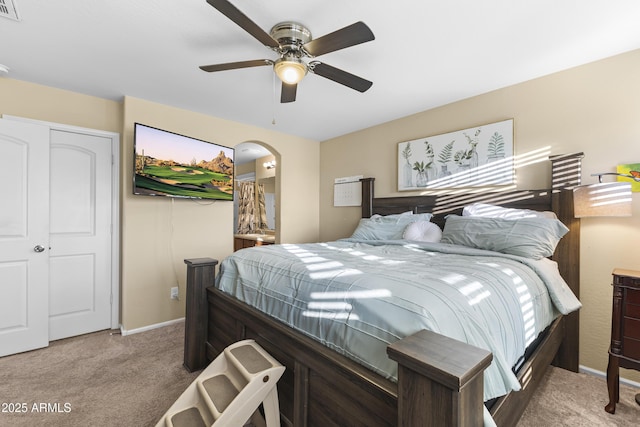 2111 N 77th Gln, Phoenix, AZ 85035 - bedroom featuring carpet, arched walkways, baseboards, and a ceiling fan