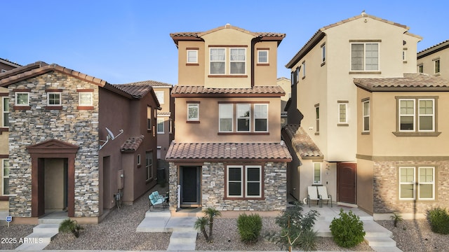2111 N 77th Gln, Phoenix, AZ 85035 - view of front facade with stucco siding and a tiled roof