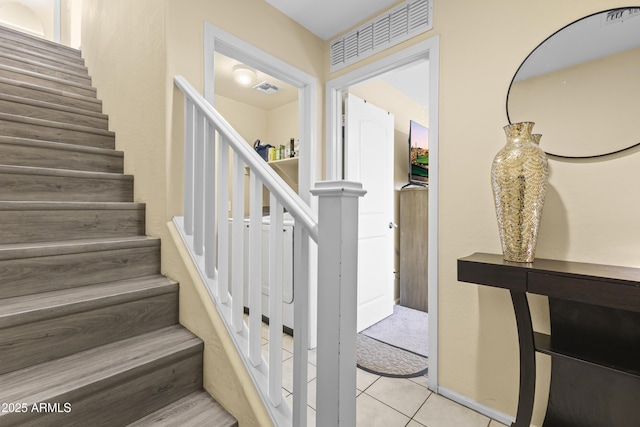 2111 N 77th Gln, Phoenix, AZ 85035 - stairway featuring tile patterned floors