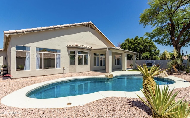 view of pool with a patio area, fence, and a fenced in pool