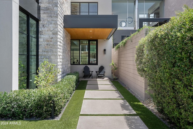 entrance to property with a balcony