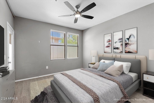 bedroom featuring ceiling fan and baseboards