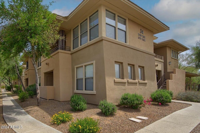 view of side of home featuring stucco siding