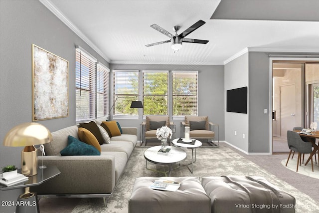 living room with carpet, crown molding, baseboards, and ceiling fan