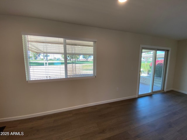 empty room with dark hardwood / wood-style floors