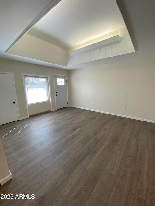 entryway with a tray ceiling and dark hardwood / wood-style floors