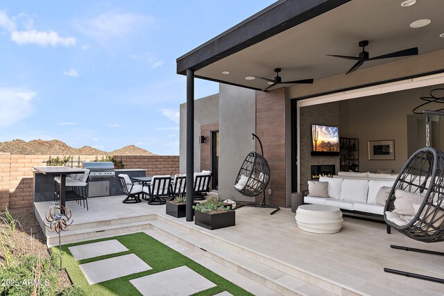 14108 E Harmony Ln, Fountain Hills, AZ 85268 - view of patio / terrace with fence, a ceiling fan, outdoor lounge area, a grill, and a mountain view