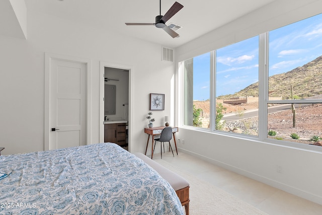 14108 E Harmony Ln, Fountain Hills, AZ 85268 - bedroom with baseboards, ensuite bath, a mountain view, and visible vents