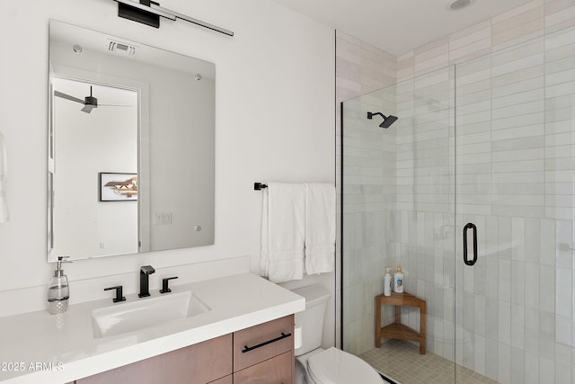 14108 E Harmony Ln, Fountain Hills, AZ 85268 - bathroom featuring a shower stall, visible vents, toilet, and vanity