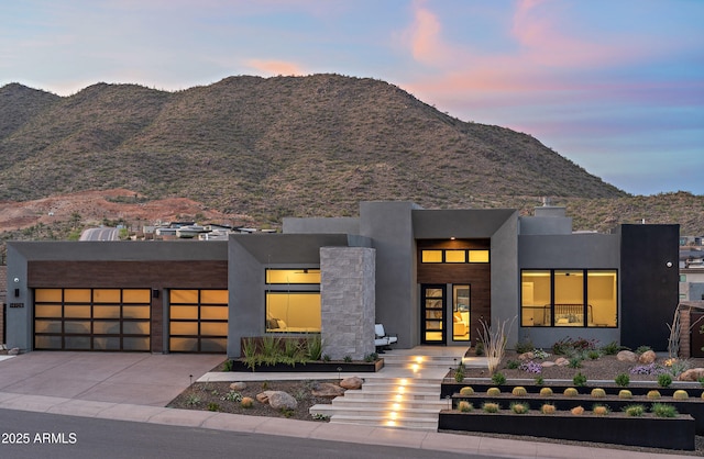 14108 E Harmony Ln, Fountain Hills, AZ 85268 - modern home featuring driveway, french doors, stucco siding, a garage, and a mountain view