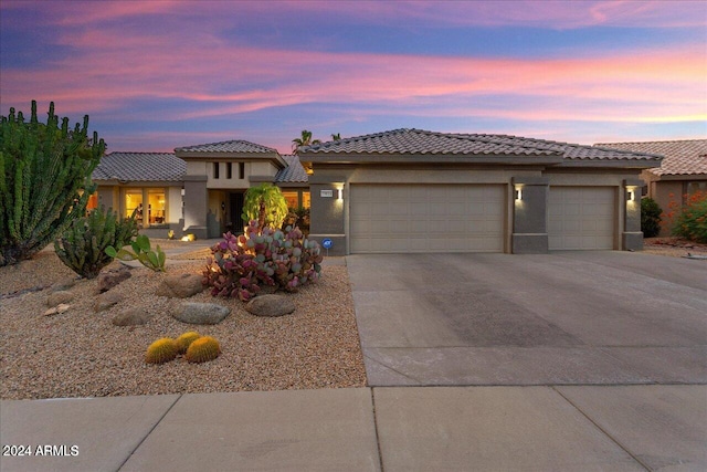 view of front of property featuring a garage