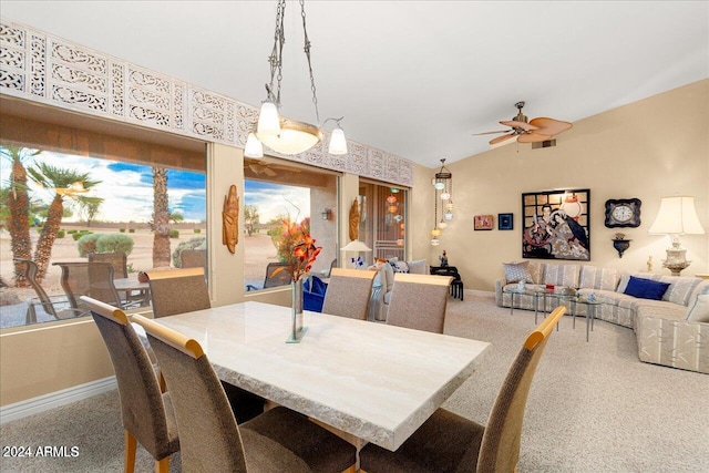 dining room with ceiling fan and vaulted ceiling