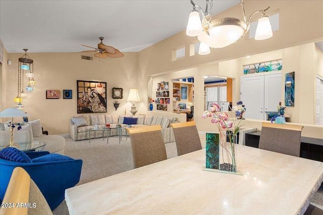 carpeted dining space with ceiling fan