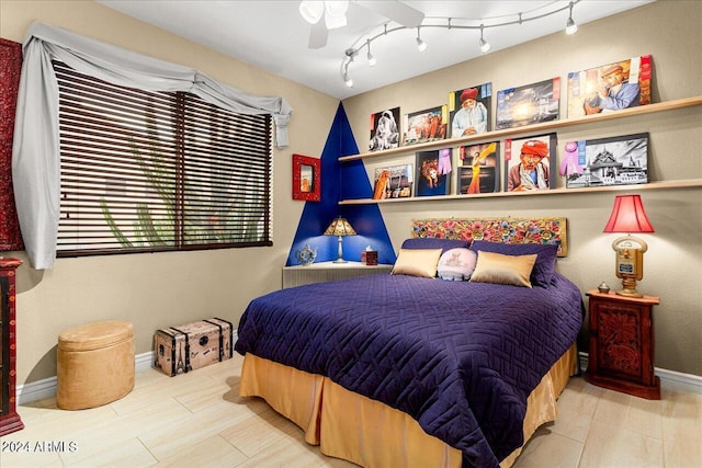 bedroom featuring track lighting