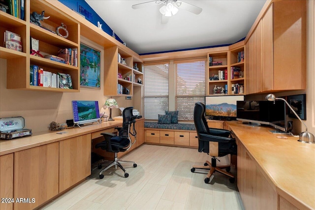 office area featuring ceiling fan and built in desk