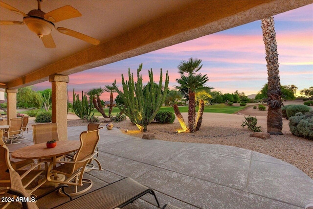 patio terrace at dusk with ceiling fan