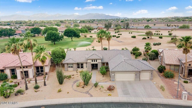 birds eye view of property with a mountain view