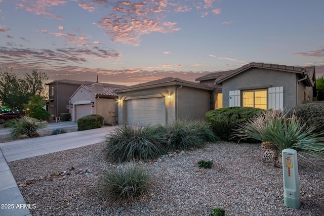 ranch-style house featuring a garage