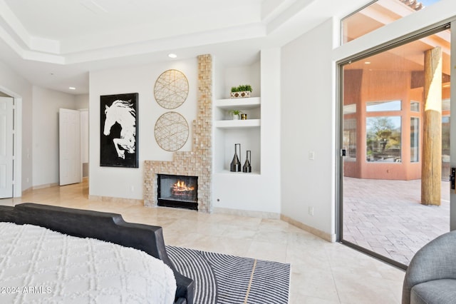 tiled bedroom featuring a tile fireplace