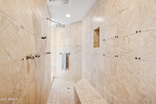 bathroom with tiled shower