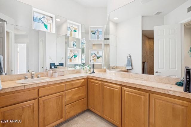 bathroom with tile patterned floors and vanity