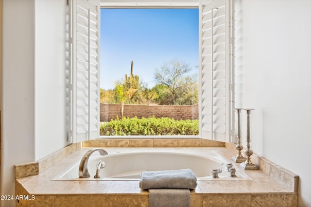 bathroom featuring tiled tub