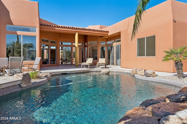 view of swimming pool with a patio area