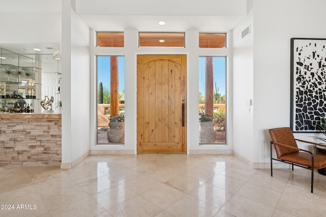 entryway featuring light tile patterned floors and a wealth of natural light