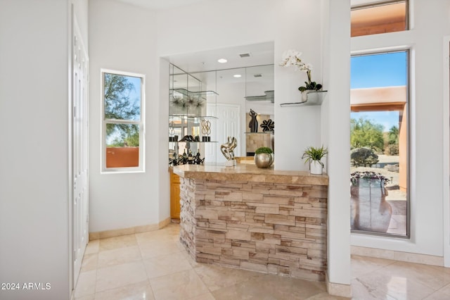 bar featuring white cabinets