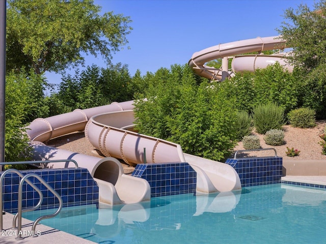 view of pool with a water slide