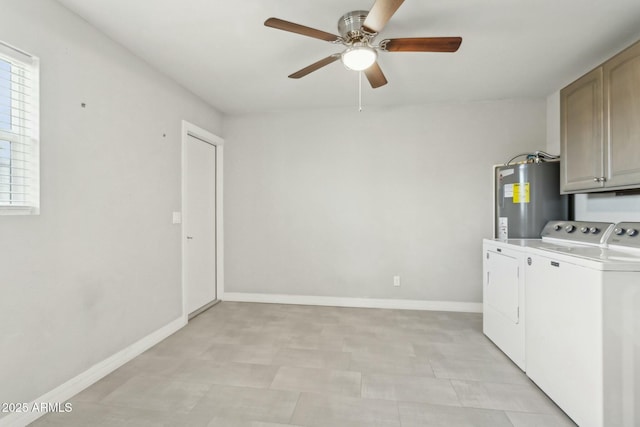 clothes washing area with separate washer and dryer, cabinets, water heater, and ceiling fan