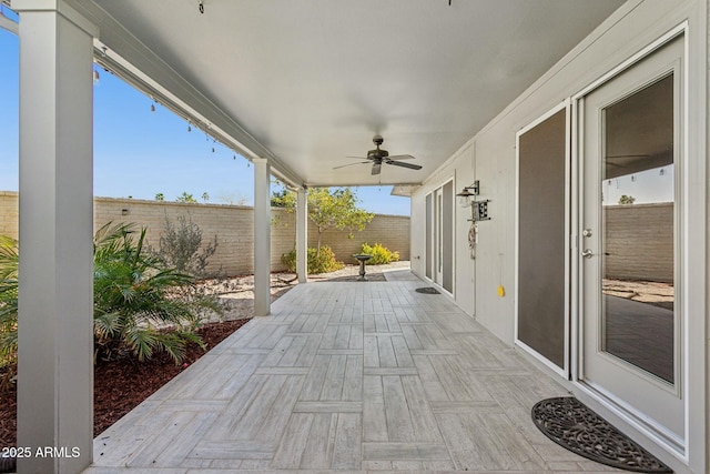 view of patio featuring ceiling fan