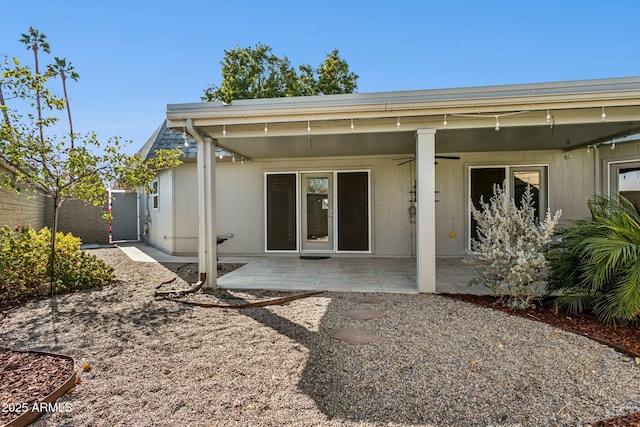 rear view of house with a patio and ceiling fan