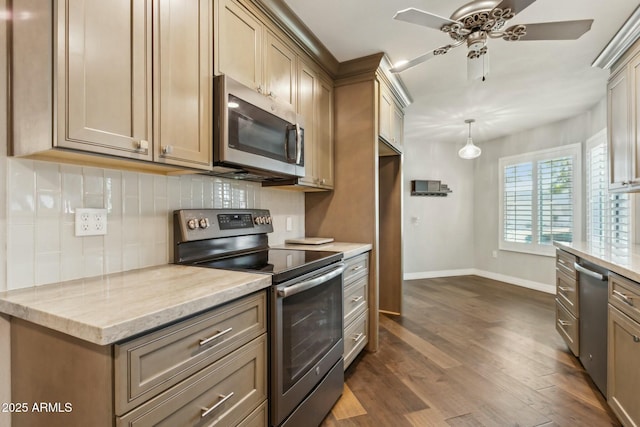 kitchen with dark wood-type flooring, ceiling fan, stainless steel appliances, tasteful backsplash, and light stone countertops