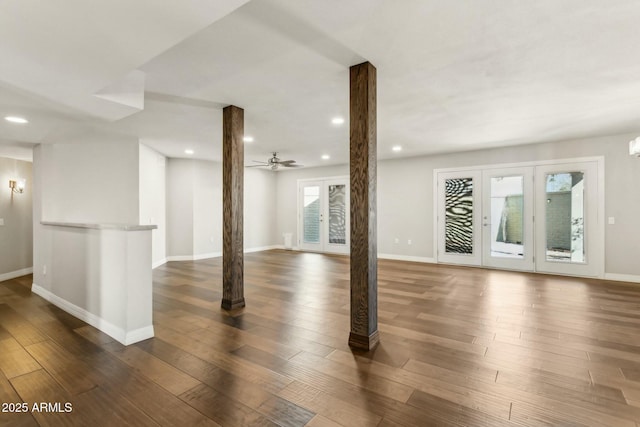 basement with french doors, ceiling fan, and dark hardwood / wood-style flooring