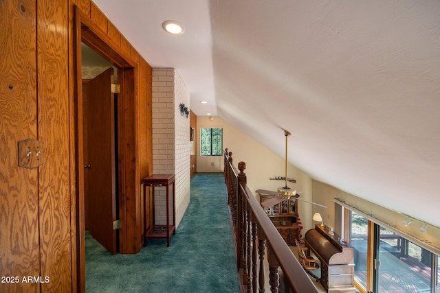 11 N County Road N1030 St, Greer, AZ 85927 - corridor with carpet floors, vaulted ceiling, healthy amount of natural light, and an upstairs landing