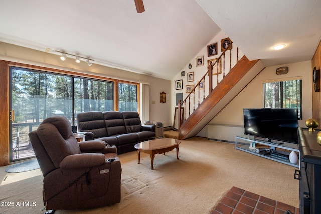 11 N County Road N1030 St, Greer, AZ 85927 - carpeted living room featuring healthy amount of natural light, stairway, track lighting, and lofted ceiling