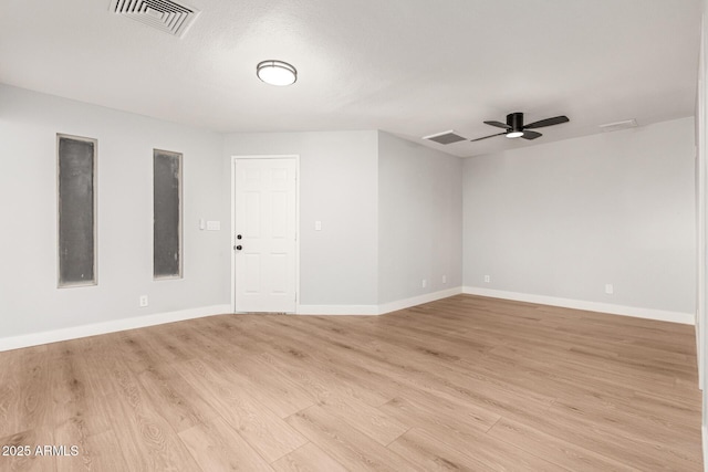 unfurnished room with ceiling fan, light hardwood / wood-style floors, and a textured ceiling