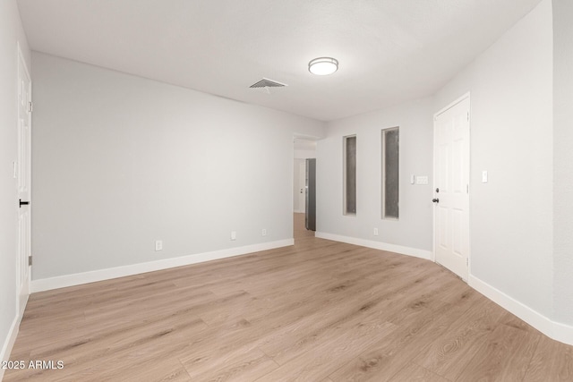 unfurnished room with light hardwood / wood-style flooring