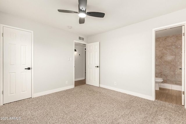 unfurnished bedroom featuring ceiling fan, ensuite bath, and carpet floors