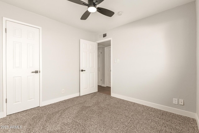 unfurnished bedroom with ceiling fan and carpet floors