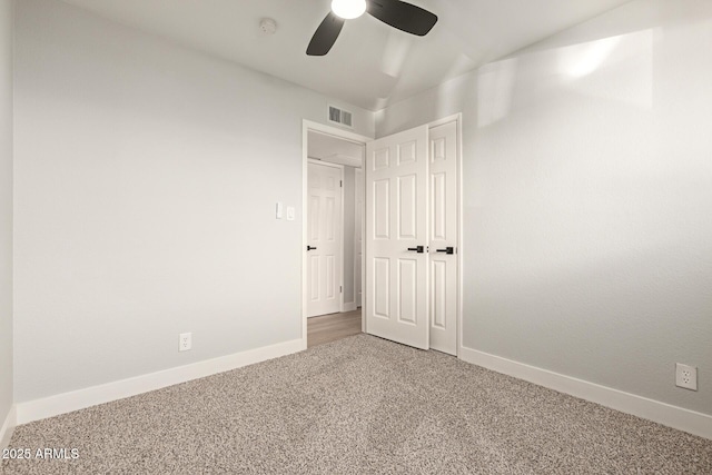 unfurnished bedroom with a closet, ceiling fan, and carpet