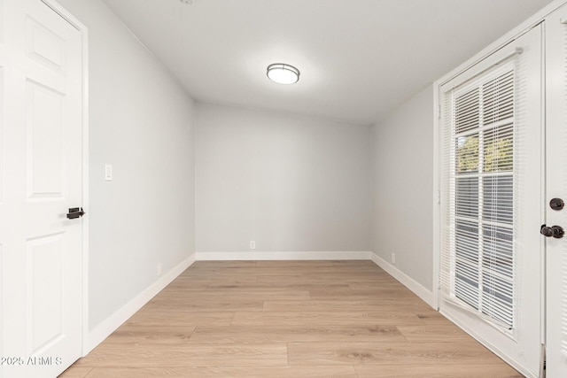 unfurnished room with light wood-type flooring