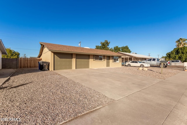 ranch-style home featuring a garage